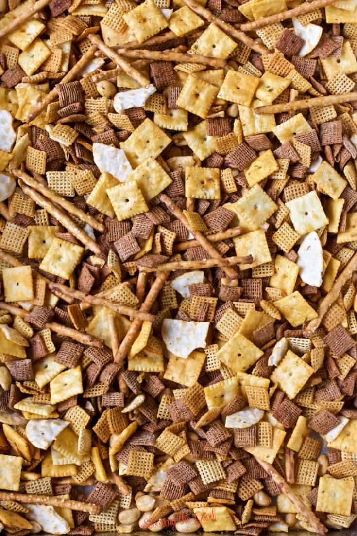 Buffalo Chex Mix Ingredients mixed in a pan