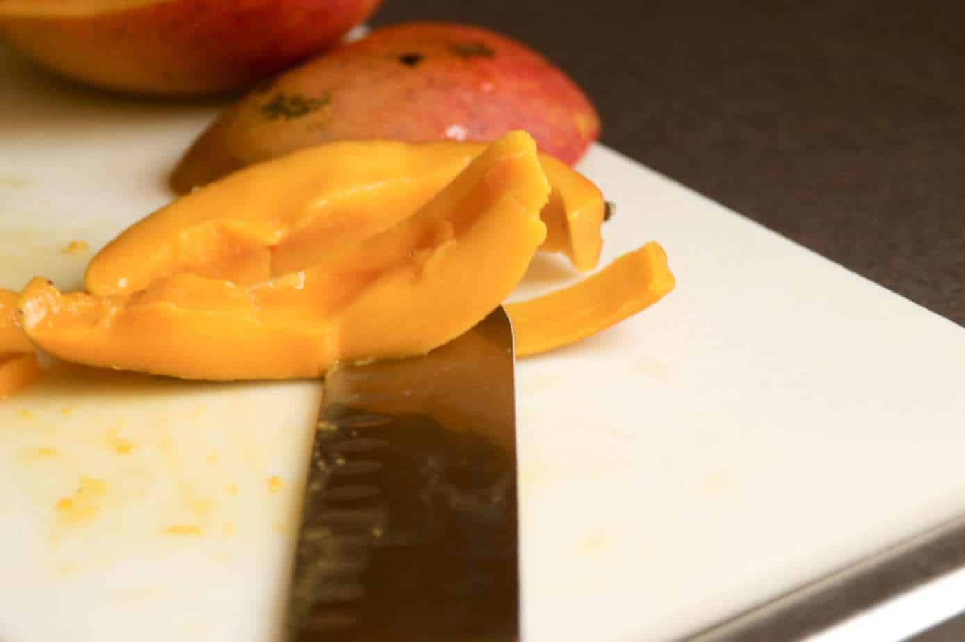 slice the edge of the mango