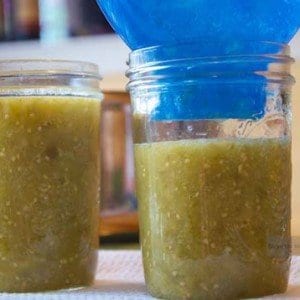 Three mason jars filled with homemade Salsa Verde.