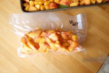 Learn how to freeze peaches by placing them in plastic bags on a table for future use.