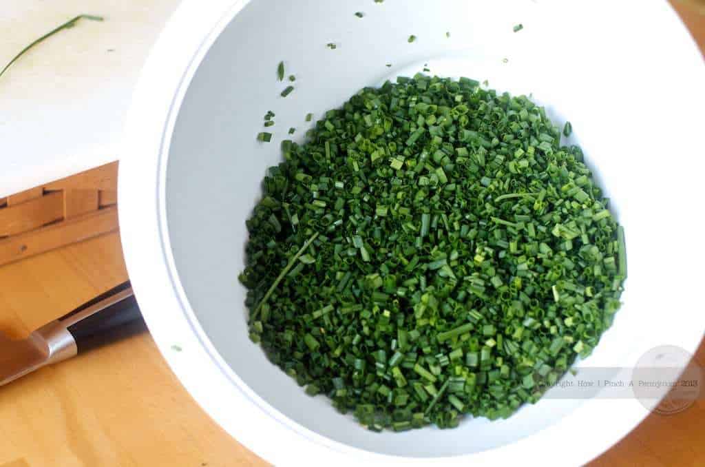 cut chives in a white bowl