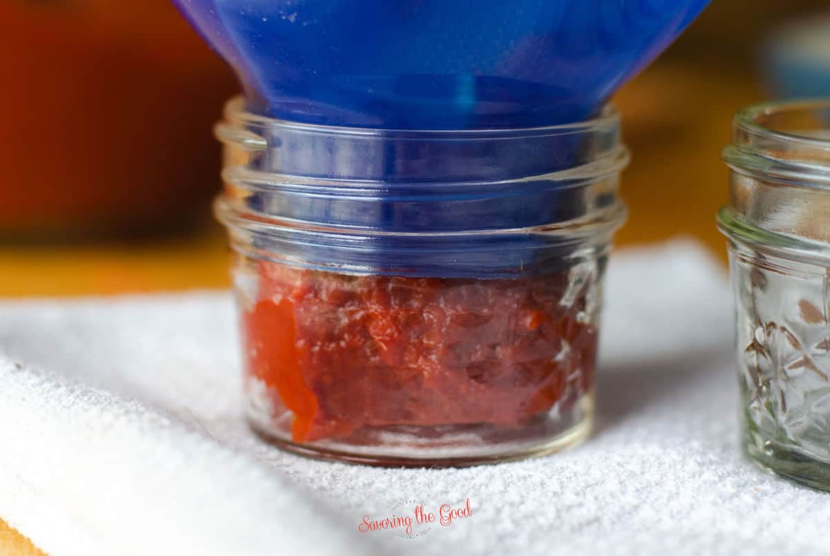 Home Made Tomato Paste with canning funnel