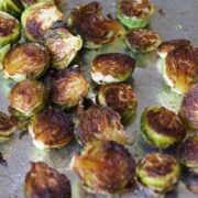 Roasted Brussels Sprouts and Broccoli on a baking sheet.