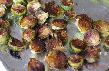 Roasted Brussels Sprouts and Broccoli on a baking sheet.