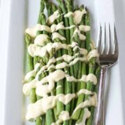 Sous Vide hollandaise on asparagus on a white plate