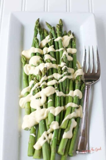 Sous Vide hollandaise on asparagus on a white plate