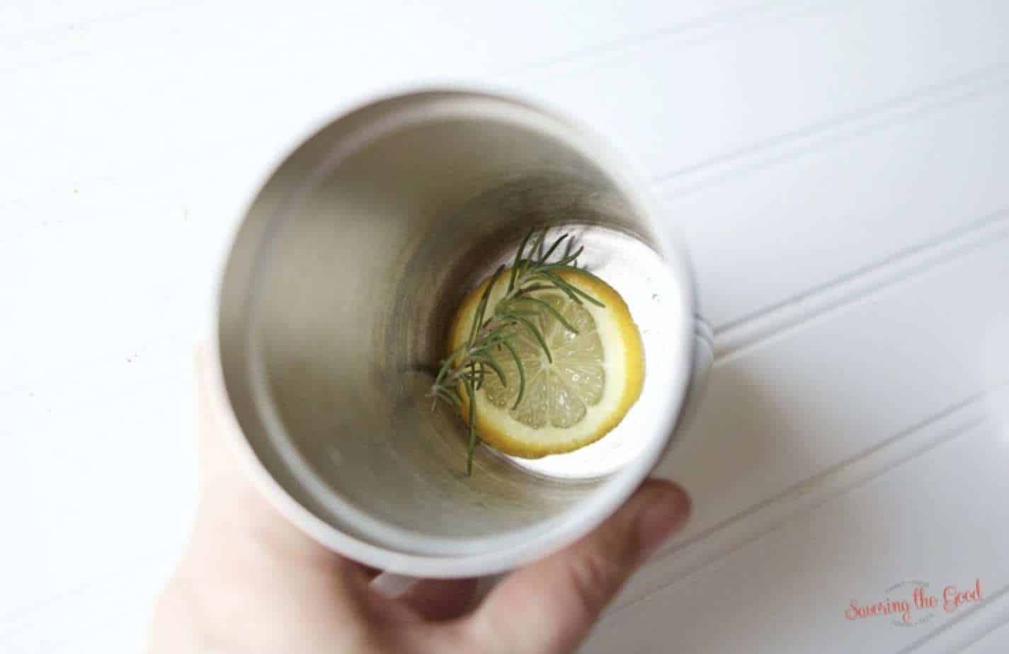 lemon and rosemary in a cocktail shaker