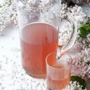 lilac syrup in a glass pitcher