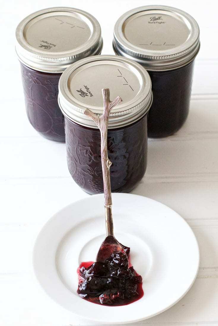 Pectin Free Cherry Jam with 3 canning jars stacked in a triangle
