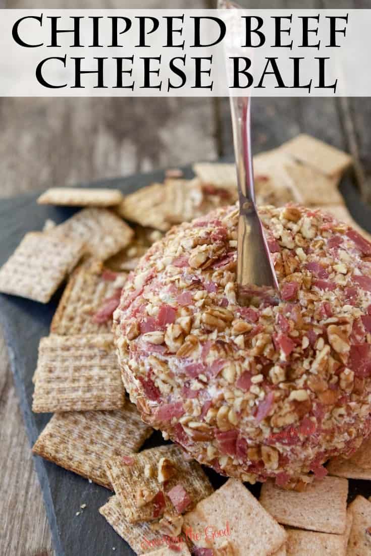 homemade Chipped Beef Cheese Ball with a silver cheese spreader pressed into it.