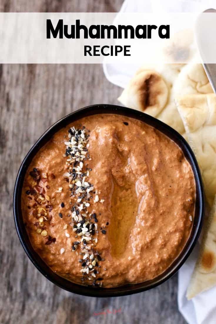 roasted red pepper and walnut dip in a black bowl