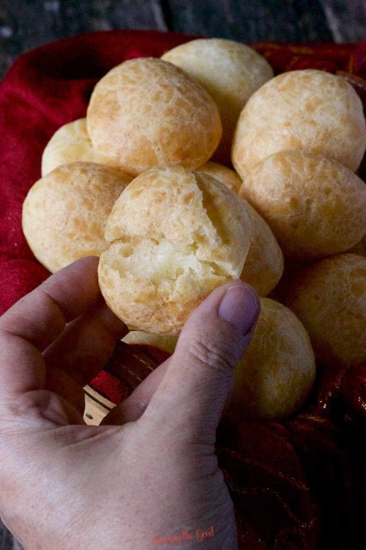 pão de queijo pulled apart to show the inside
