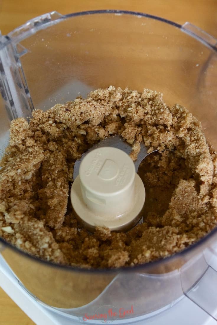 Brown sugar and butter mixture in a food processor bowl, partially blended with the blade attachment visible-perfect for starting your next Blueberry Delight Recipe.