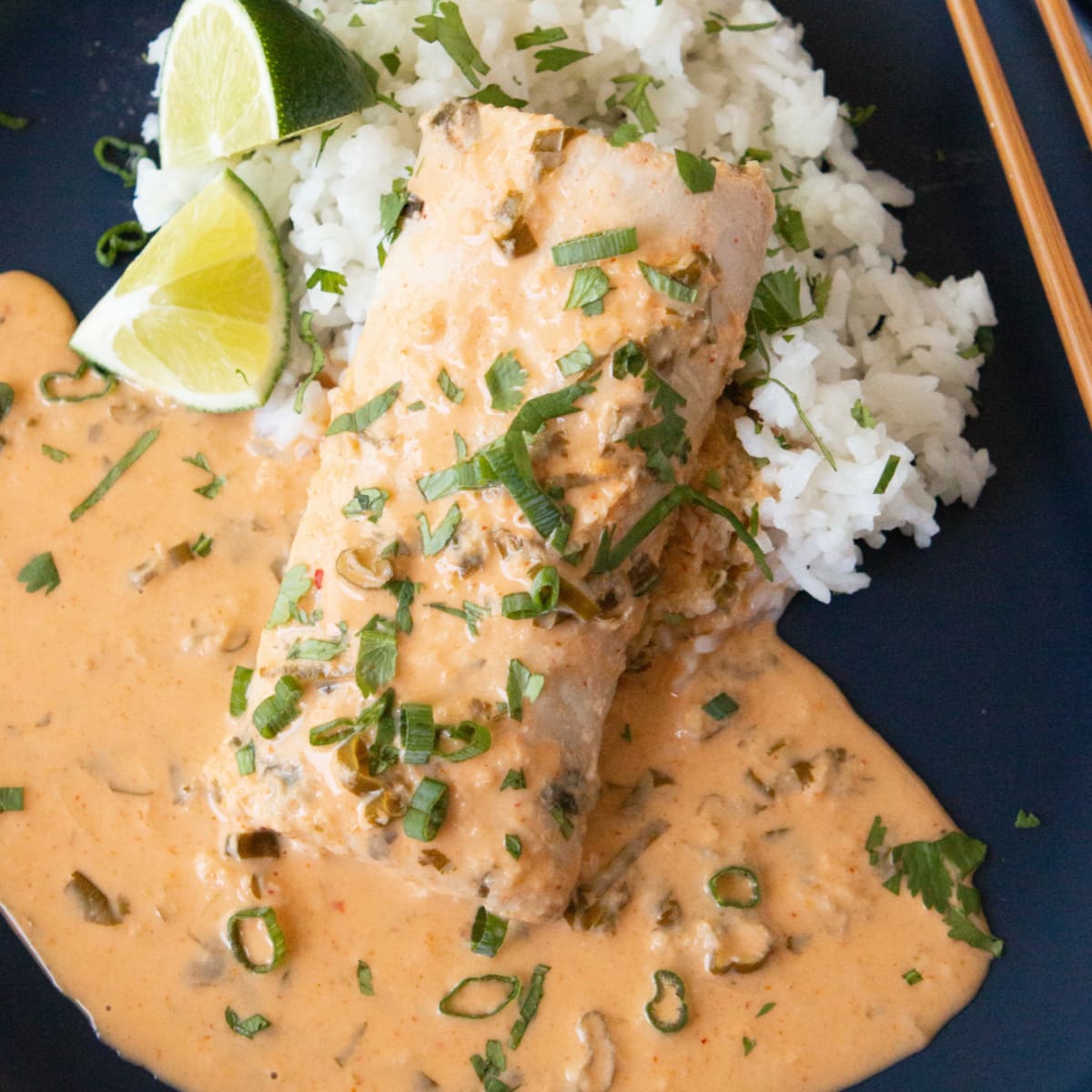 Sous Vide Mahi-Mahi with Thai Coconut Curry Sauce on a blue plate with white rice