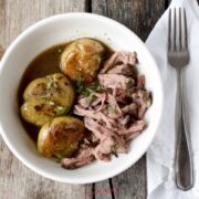 Sous Vide Mississippi Pot Roast Recipe in a shite bowl with a fork to the side