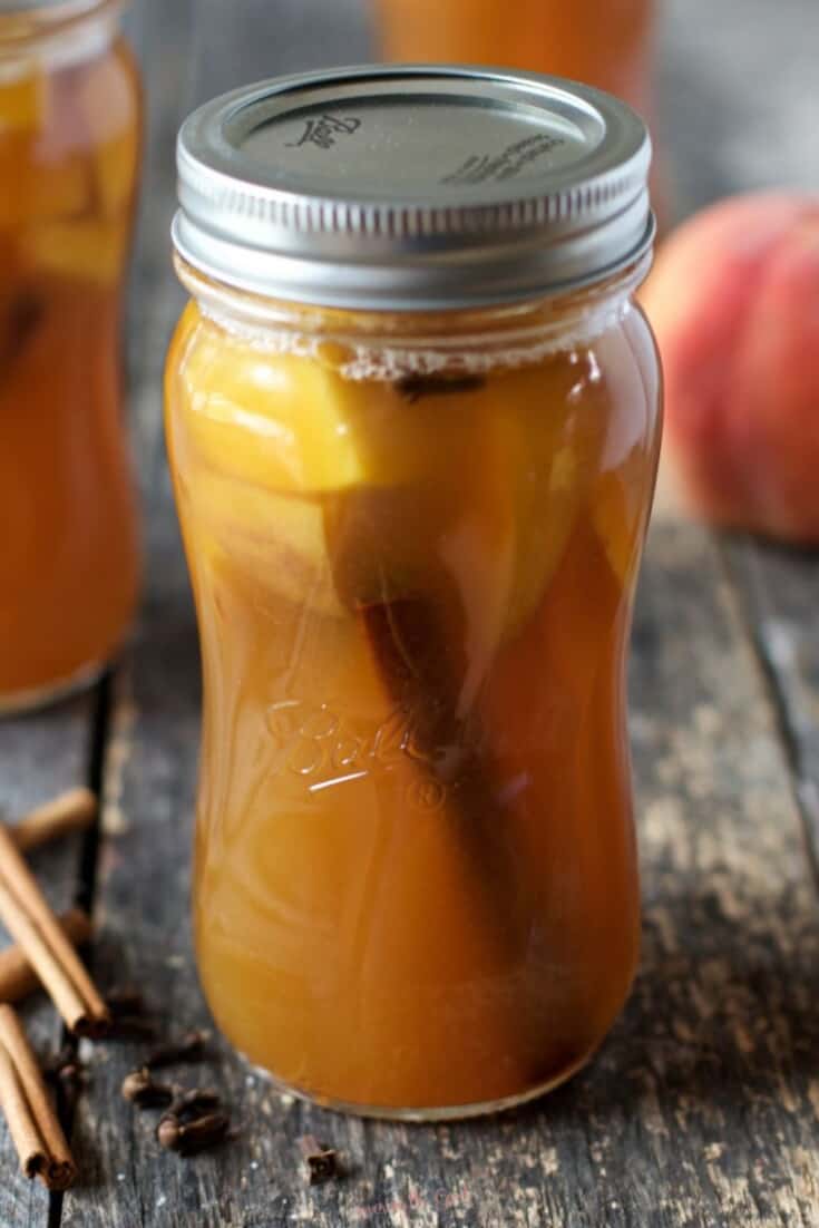 peach moonshine recipe in a quart mason jar