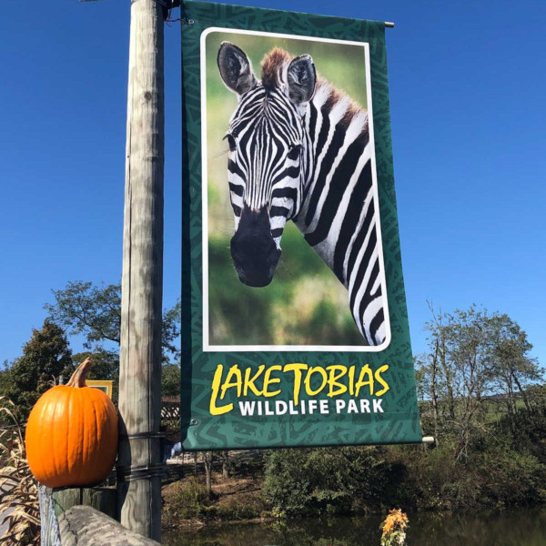 sign at Lake Tobias Wildlife Park with a zebra on it