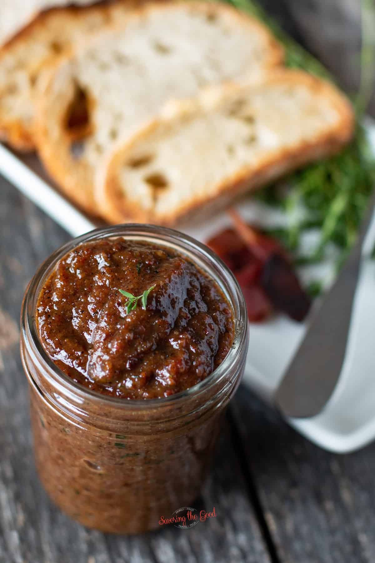 bacon jam with thyme garnish, vertical image