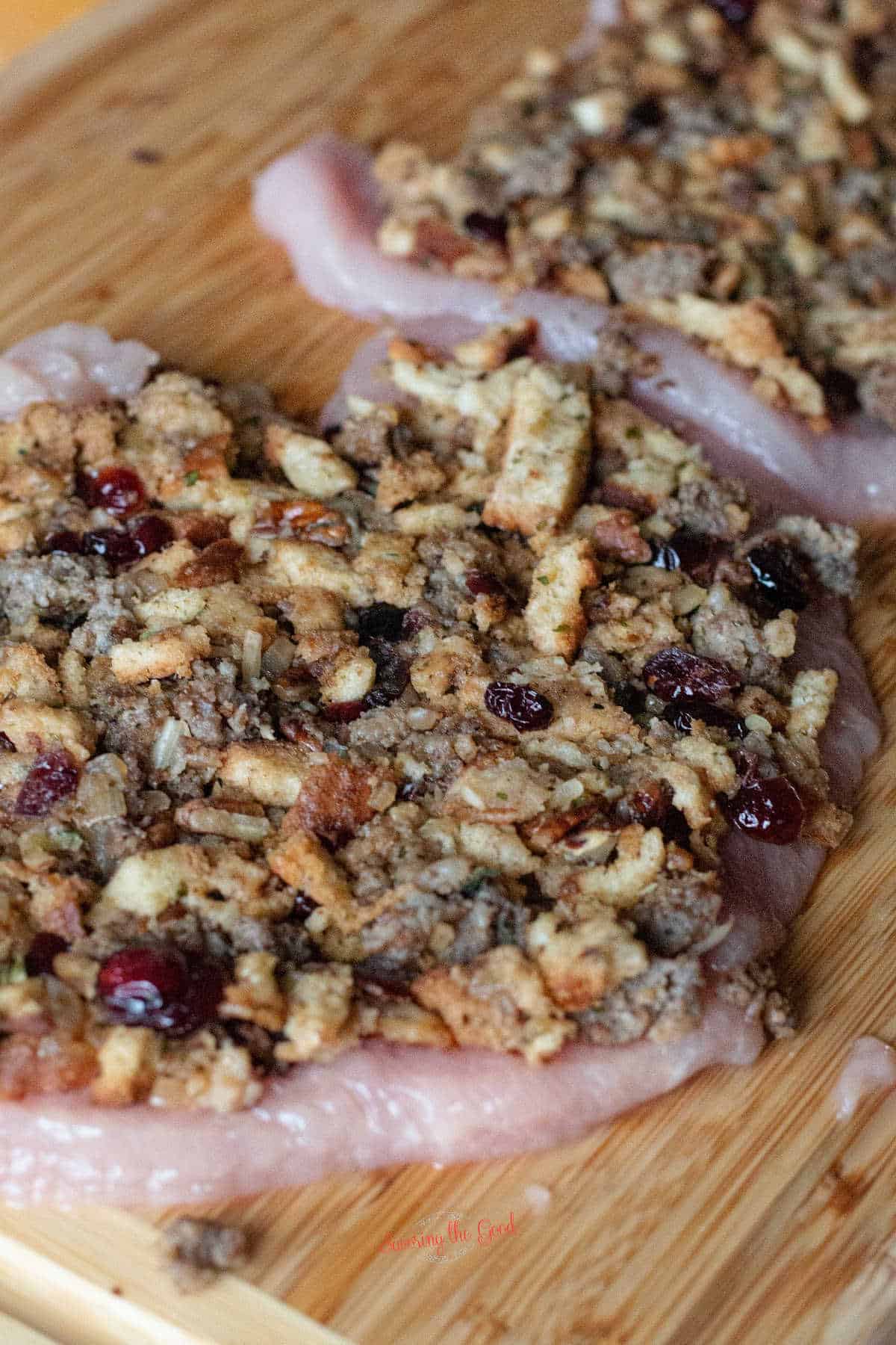 cranberry sage stuffing pressed into a flattened turkey breast