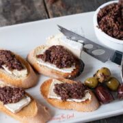 Olive tapenade on bread with cheese