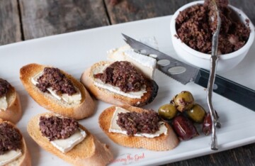 Olive tapenade on bread with cheese