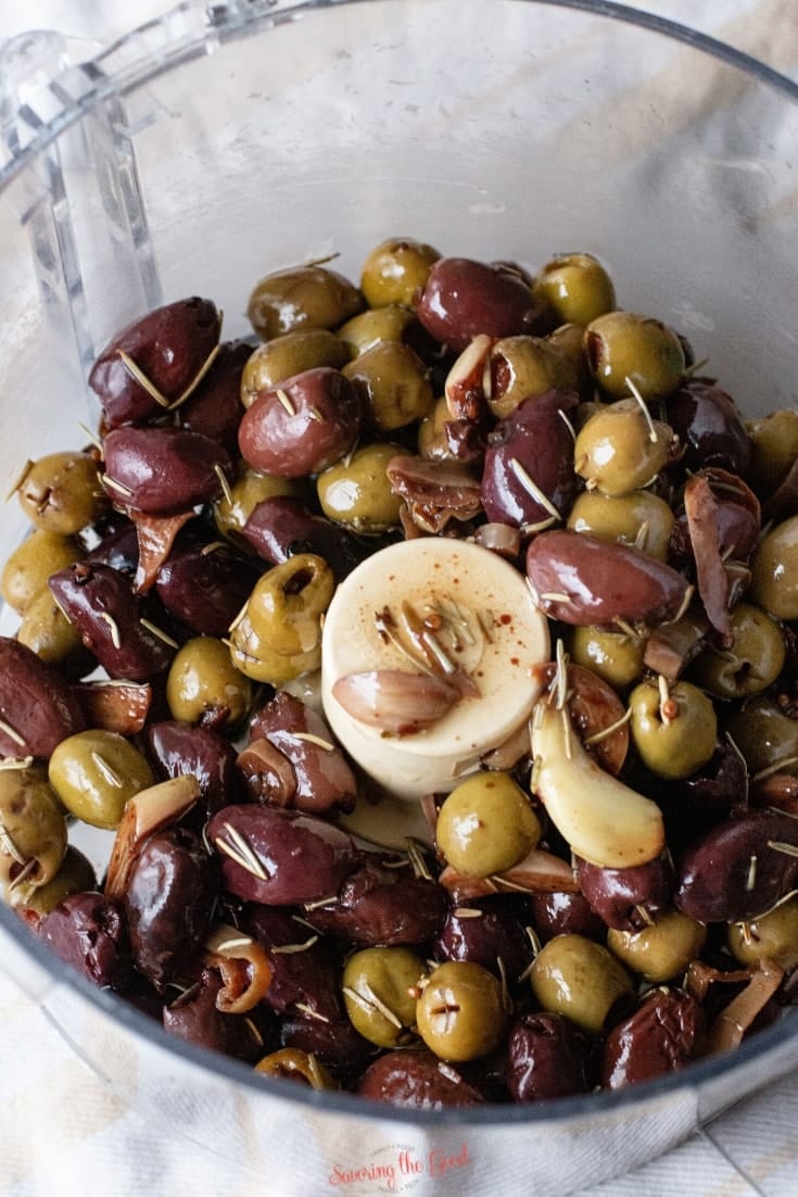 olives in a food processor ready to be blended