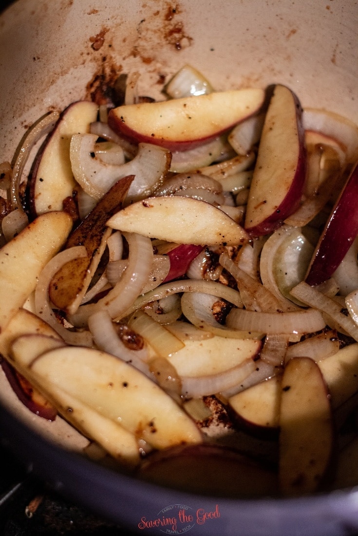 apples on onions in a dutch oven for Pork and Sauerkraut