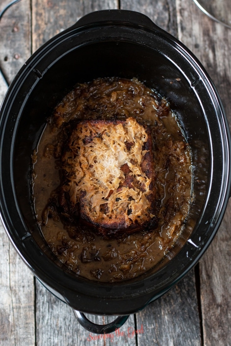 pork and sauerkraut cooked in a slow cooker, brown and caramelized