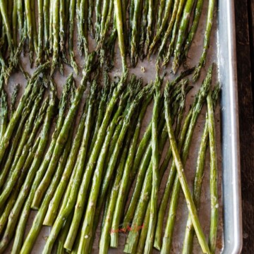 Roasted asparagus recipe on a baking sheet.