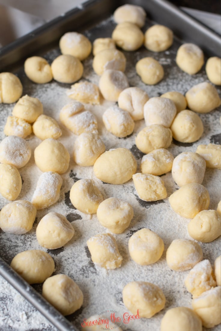 gnudi on a sheet tray ready to be frozen