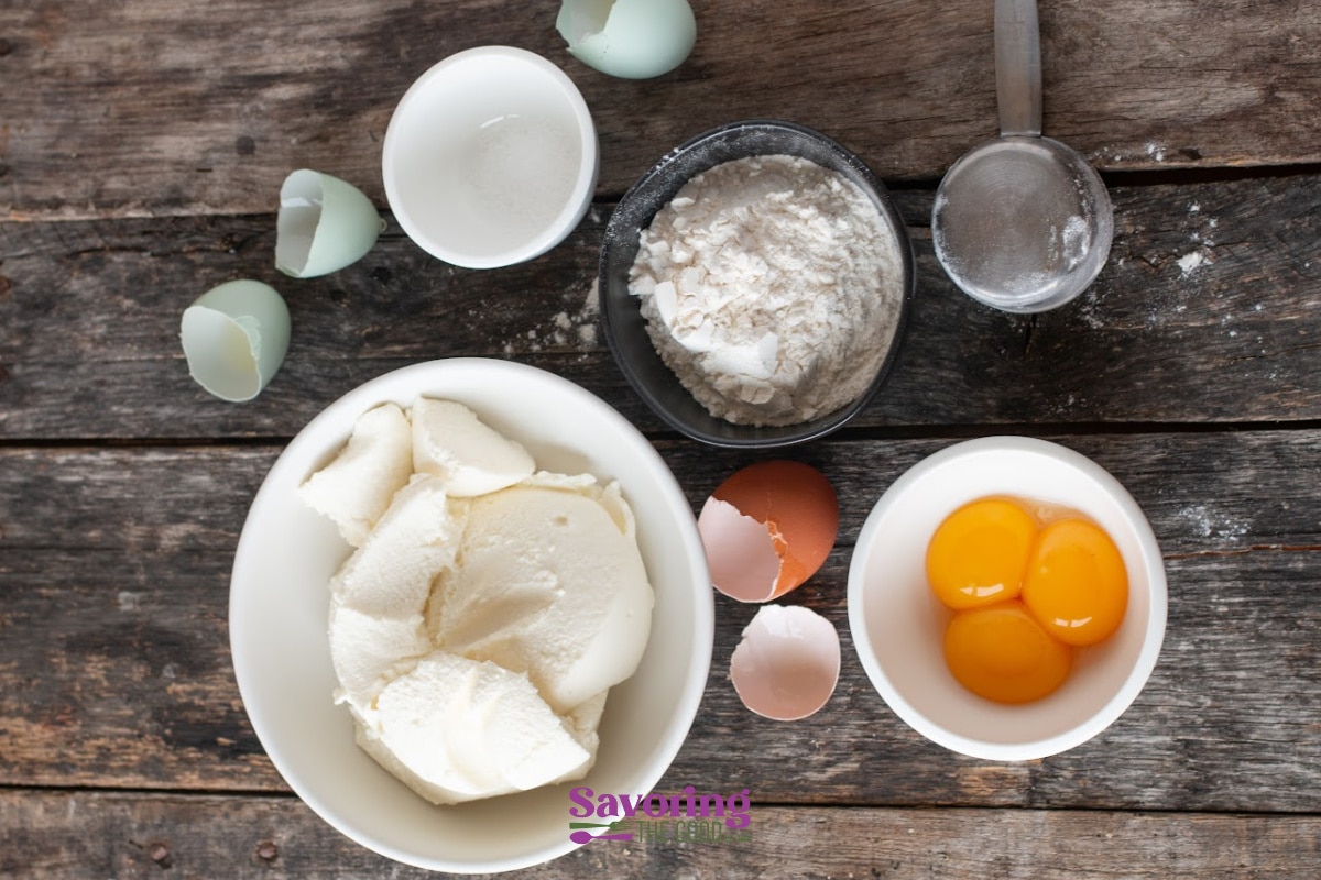 gnudi ingredients in bowls on a wooden surface