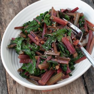 Beet Greens in a serving bowl, square image