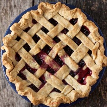 Black Raspberry Pie baked in a blue pie plate