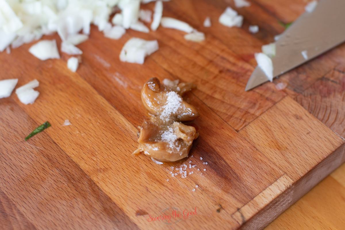 salt on roasted garlic cloves