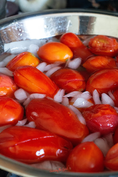 roma tomatoes in an icebath
