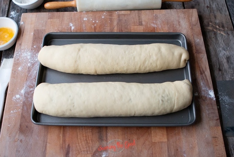 2 nut rolls on a baking sheet