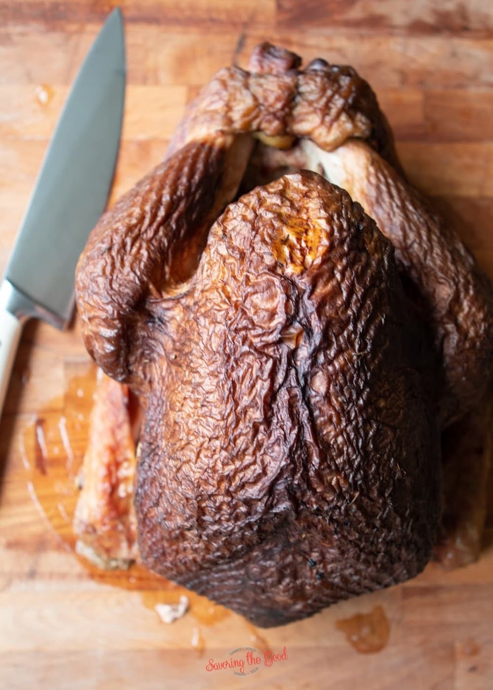 Whole smoked turkey on a cutting board