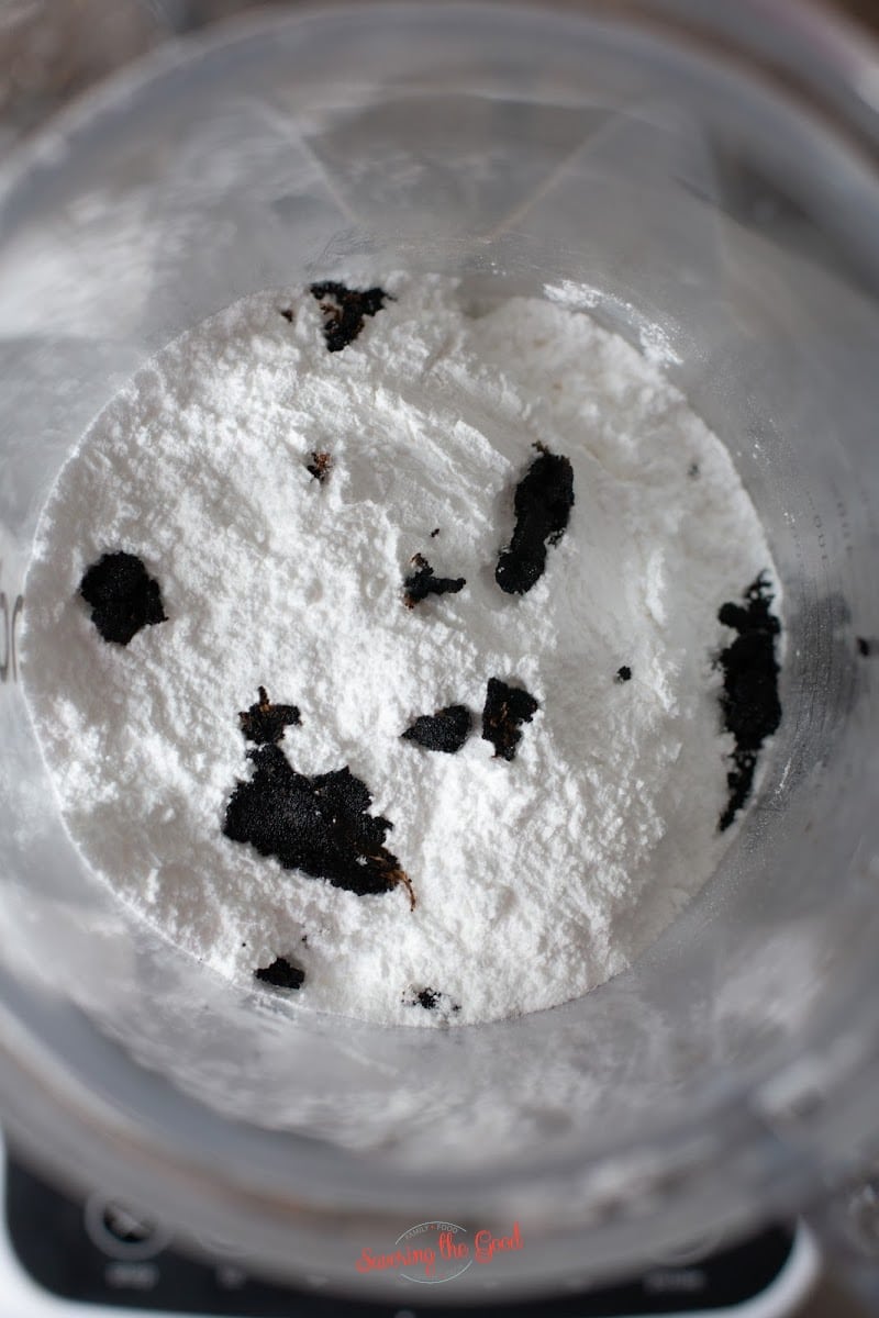 powdered sugar and vanilla beans in a blender for DIY starbucks vanilla bean powder