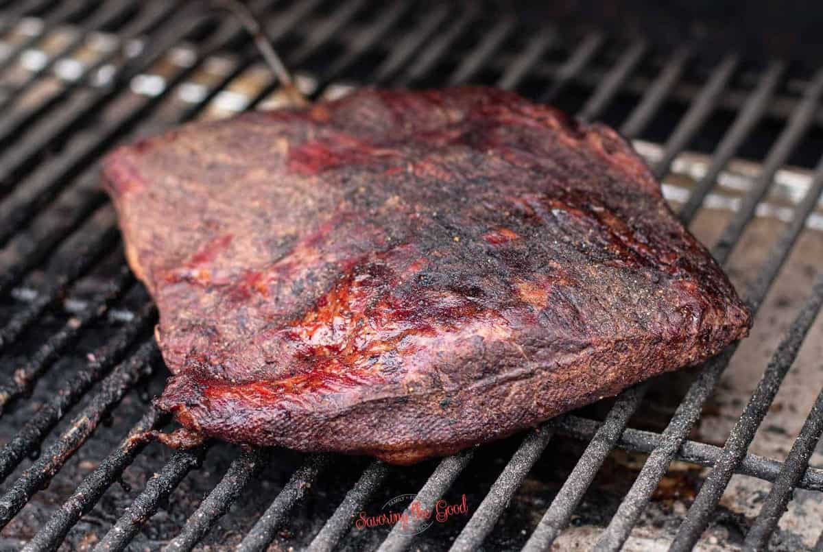 smoked brisket on a smoker showing colors and texture