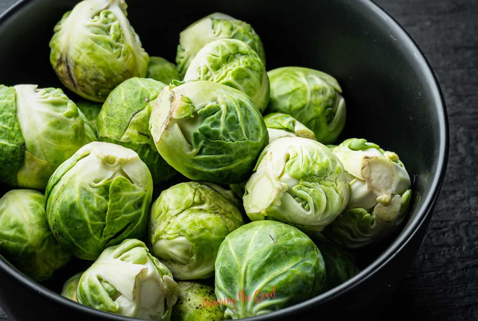 Brussels sprouts in a bowl on a table.
