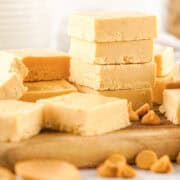2 ingredient peanut butter fudge recipe sticked on a cutting board.