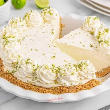A no bake key lime pie with a slice taken out of it.