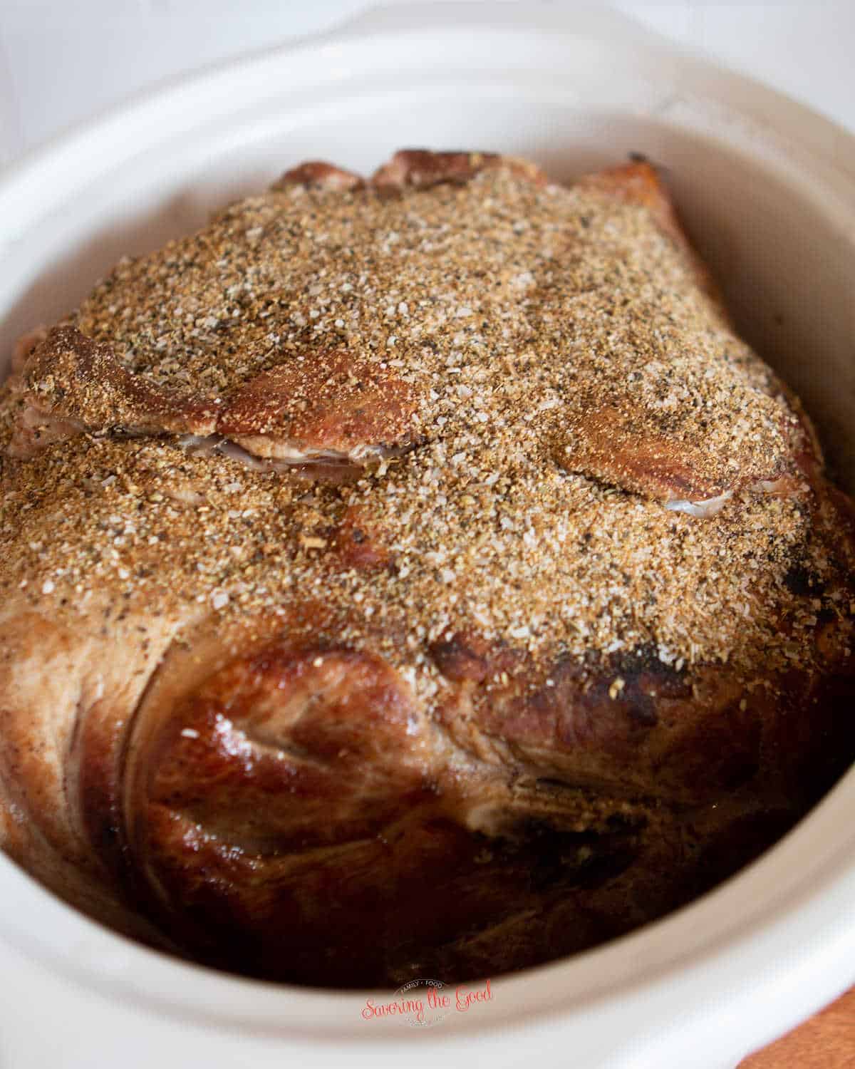 seared boston butt in a crock-pot with seasoning