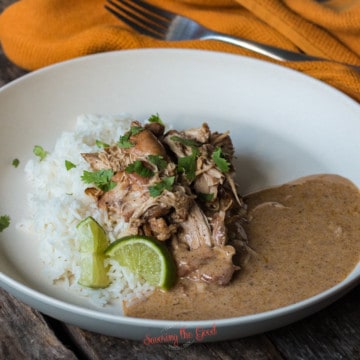 horizontal image of cilantro lime chicken on a bed of rice with sauce