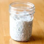 tzatziki sauce in a glass jar square image