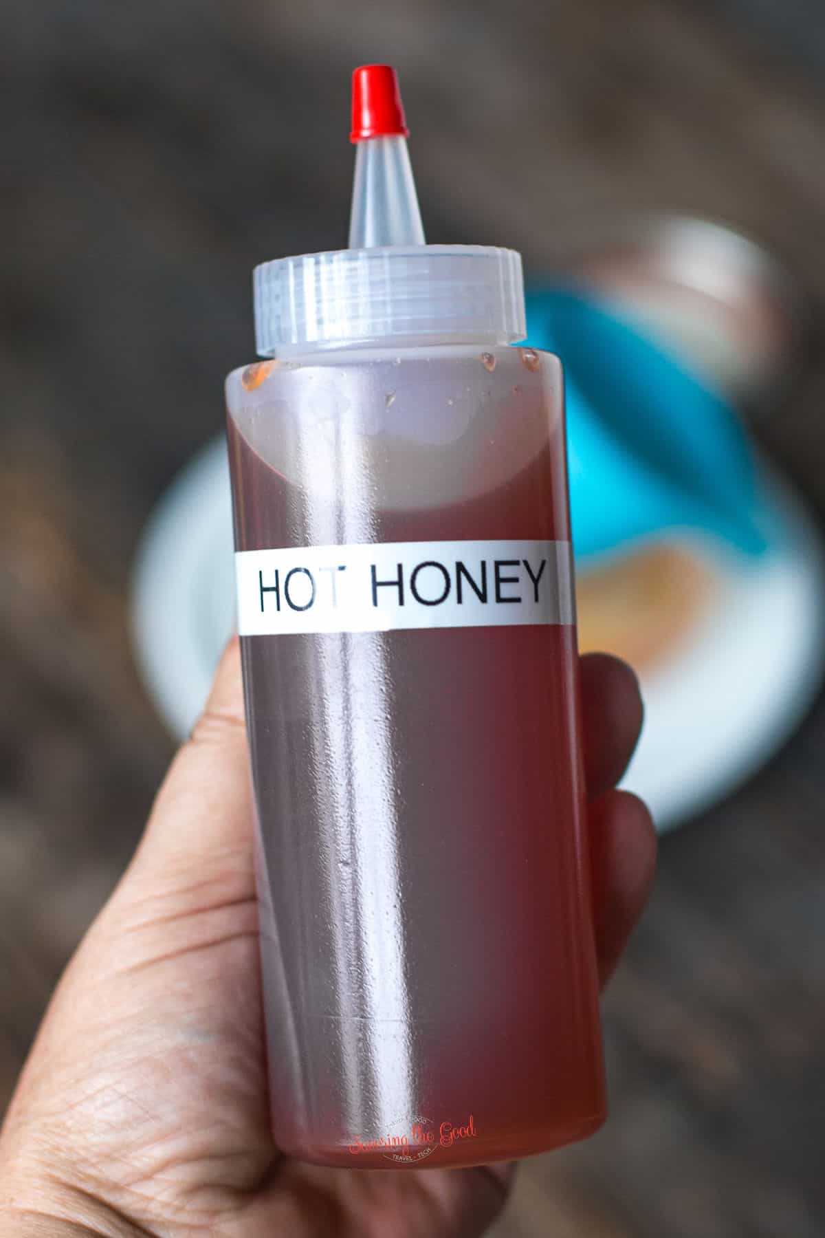 Hot Honey in a squeeze bottle with a label naming what is