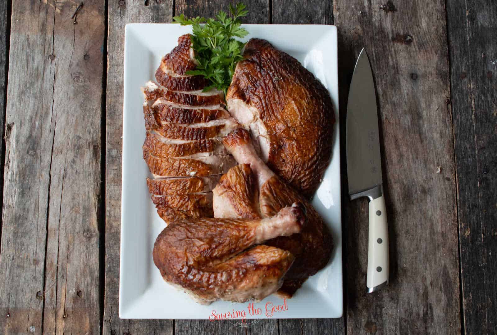 carved turkey on a white platter
