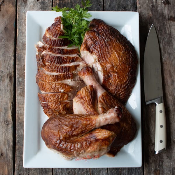 entire turkey carved and arranged on a white plater