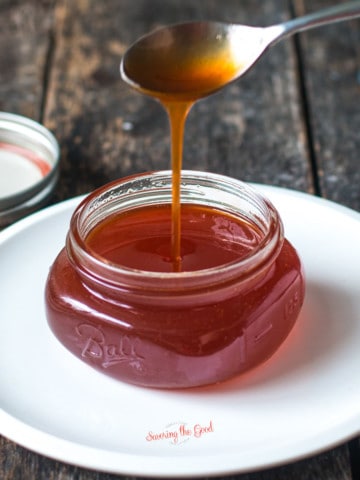 homemade Hot Honey being poured off a spoon