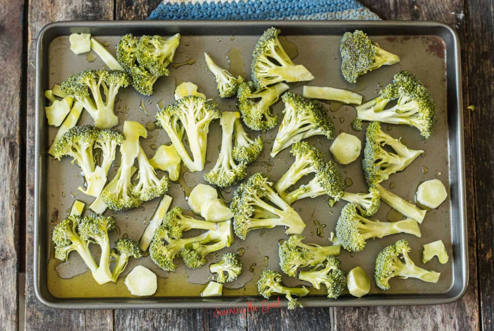 broccoli on a sheet pan before roasting